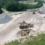 Action shot from a bird's eye view of rock truck, dozer & loader 06/11