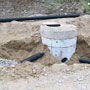 Sump and riser for catch basin; pipe for underdrain still exposed 06/11